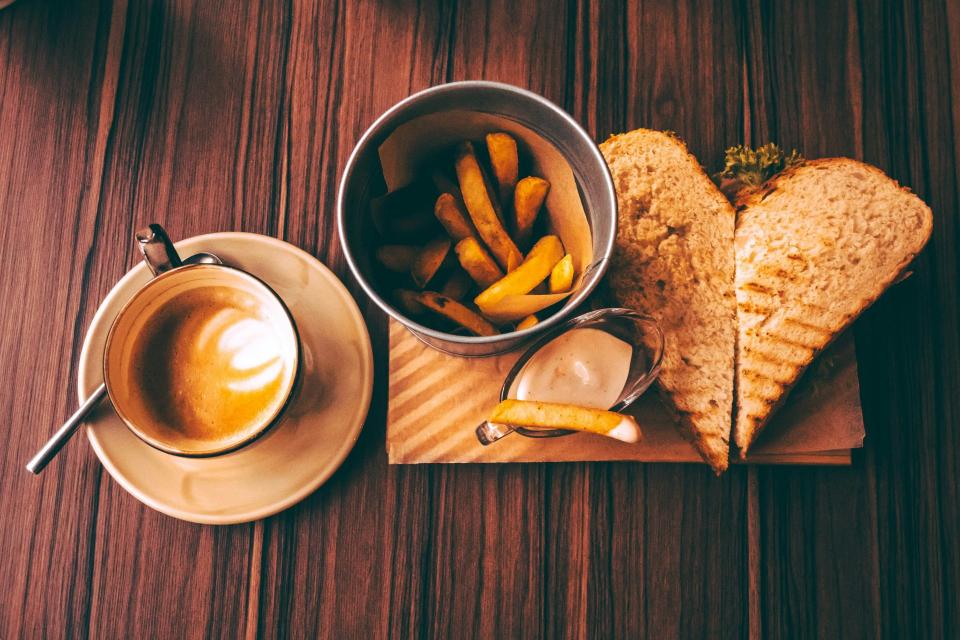 Toasted sandwich, fries, and cappuccino moment.