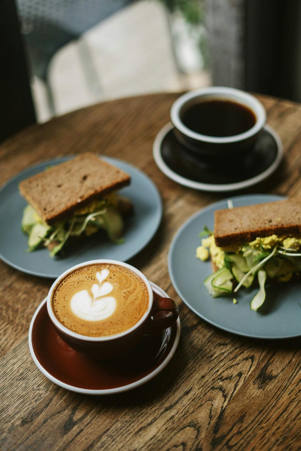 Three sandwiches and two coffees shared.